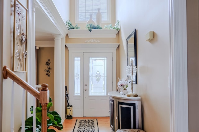 8834 Doubletree Dr N, Crown Point, IN 46307 - entrance foyer featuring wood finished floors, ornate columns, and ornamental molding