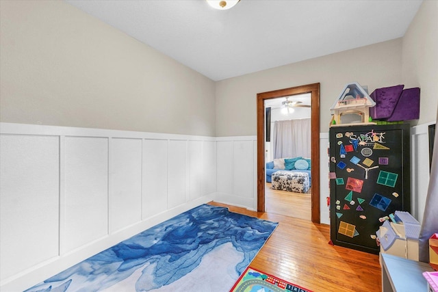 512 S Scarborough St, Sidney, IL 61877 - bedroom featuring wood-type flooring, a wainscoted wall, and a decorative wall