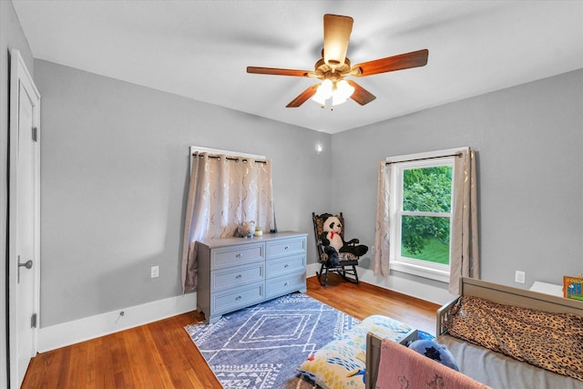 512 S Scarborough St, Sidney, IL 61877 - bedroom with wood finished floors, baseboards, and a ceiling fan