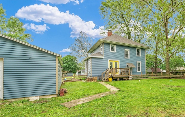 512 S Scarborough St, Sidney, IL 61877 - back of property featuring a chimney, a deck, and french doors