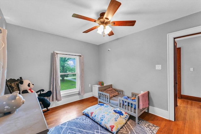 512 S Scarborough St, Sidney, IL 61877 - bedroom with wood finished floors, baseboards, and ceiling fan