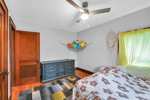 512 S Scarborough St, Sidney, IL 61877 - bedroom with wood finished floors, a ceiling fan, and baseboards