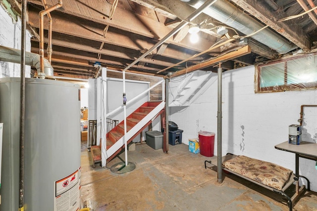 512 S Scarborough St, Sidney, IL 61877 - unfinished below grade area featuring gas water heater and stairs