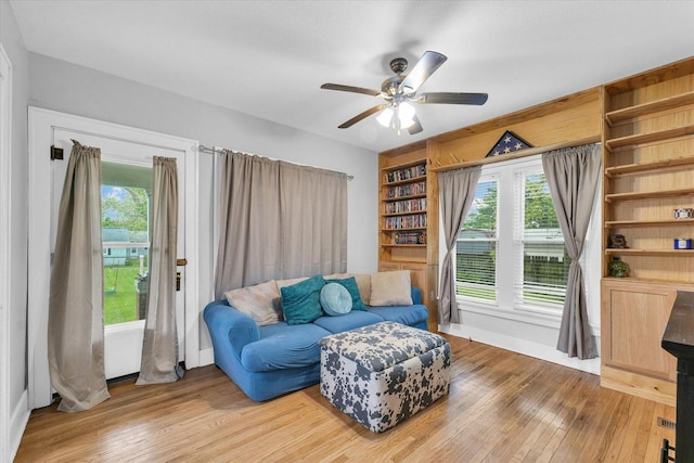 512 S Scarborough St, Sidney, IL 61877 - sitting room featuring light wood finished floors, ceiling fan, and baseboards