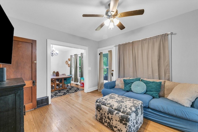 512 S Scarborough St, Sidney, IL 61877 - living area with a ceiling fan, light wood-style floors, and baseboards