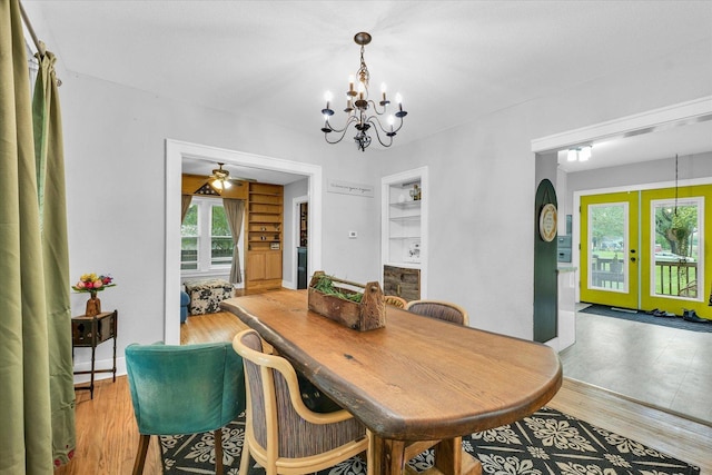 512 S Scarborough St, Sidney, IL 61877 - dining area featuring a chandelier, light wood-style flooring, a ceiling fan, and french doors