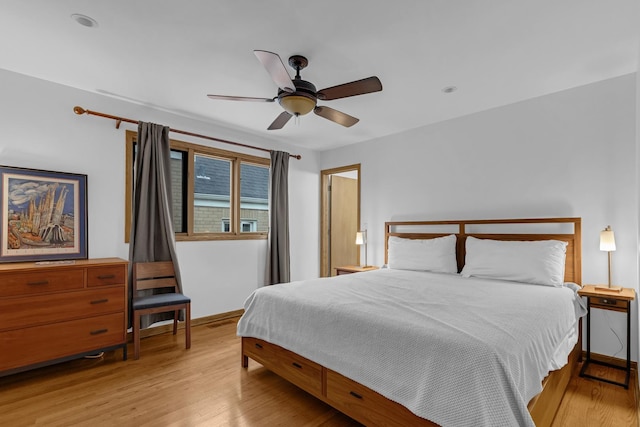 7260 W Fitch Ave, Chicago, IL 60631 - bedroom with wood finished floors, baseboards, and ceiling fan