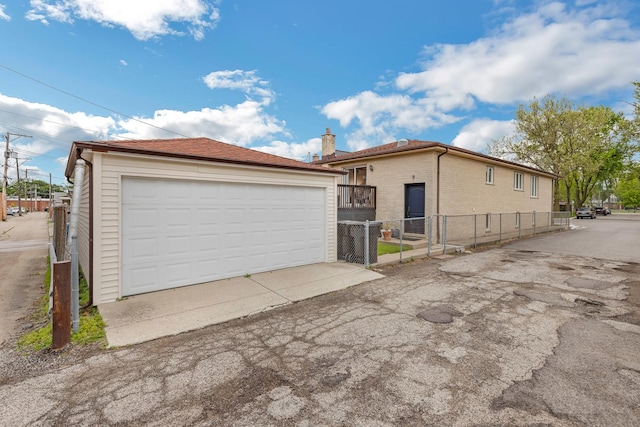 7260 W Fitch Ave, Chicago, IL 60631 - view of side of property featuring a garage, an outbuilding, a chimney, and brick siding