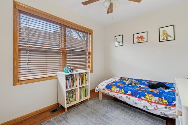 1235 Euclid Ave, Berwyn, IL 60402 - bedroom with wood finished floors, baseboards, and ceiling fan