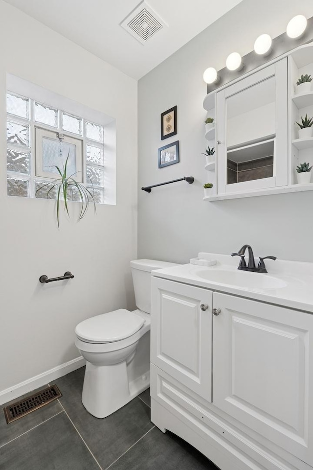 1235 Euclid Ave, Berwyn, IL 60402 - half bathroom with toilet, tile patterned floors, and vanity