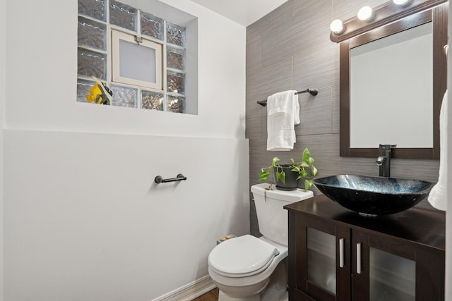 1235 Euclid Ave, Berwyn, IL 60402 - bathroom featuring tile walls, toilet, and vanity