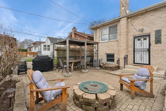 1235 Euclid Ave, Berwyn, IL 60402 - view of patio with a grill, a fire pit, fence, and outdoor dining area