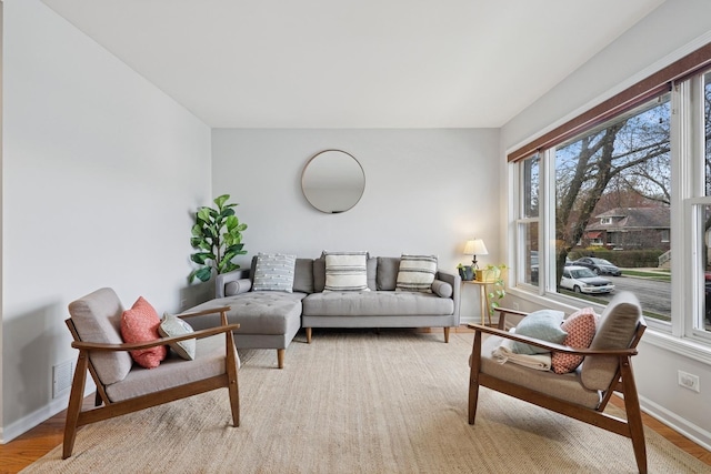 1235 Euclid Ave, Berwyn, IL 60402 - living room featuring baseboards and wood finished floors