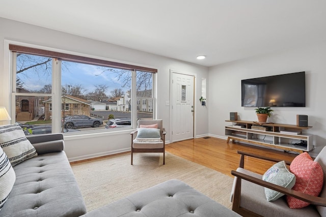 1235 Euclid Ave, Berwyn, IL 60402 - living area with baseboards, plenty of natural light, wood finished floors, and recessed lighting