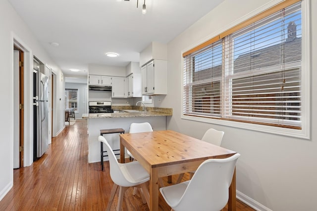 1235 Euclid Ave, Berwyn, IL 60402 - dining area with baseboards, wood-type flooring, and recessed lighting
