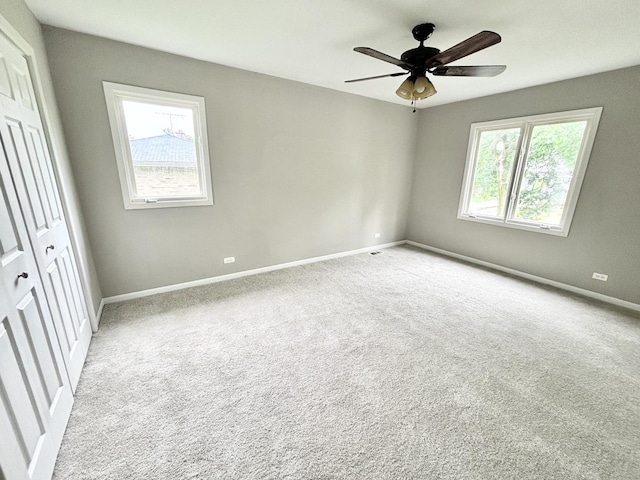 615 N Blanchard St, Wheaton, IL 60187 - unfurnished bedroom with light colored carpet, baseboards, and ceiling fan