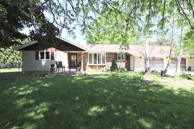 245 N Linn St, Princeton, IL 61356 - ranch-style house featuring a garage