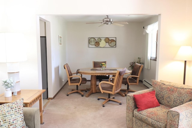 245 N Linn St, Princeton, IL 61356 - dining area with baseboard heating, light colored carpet, and ceiling fan