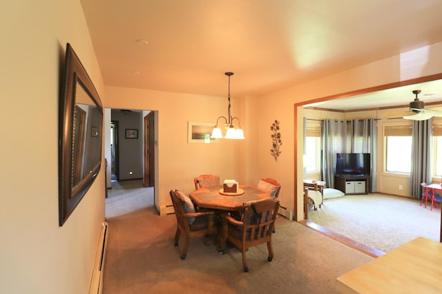 245 N Linn St, Princeton, IL 61356 - dining area with light colored carpet, a chandelier, baseboard heating, and ceiling fan