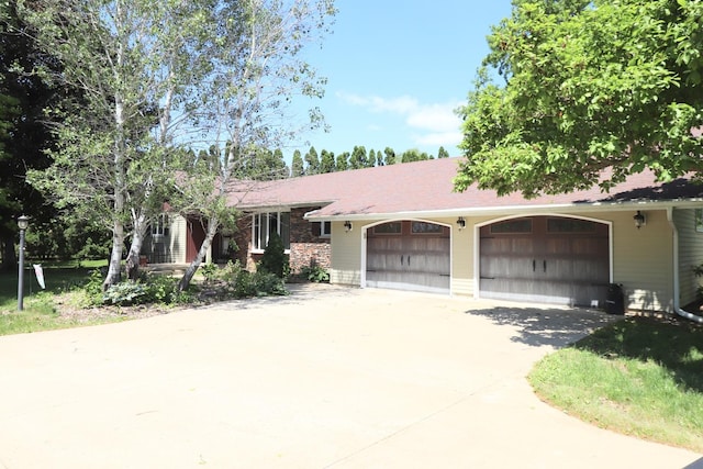 245 N Linn St, Princeton, IL 61356 - single story home with concrete driveway and an attached garage