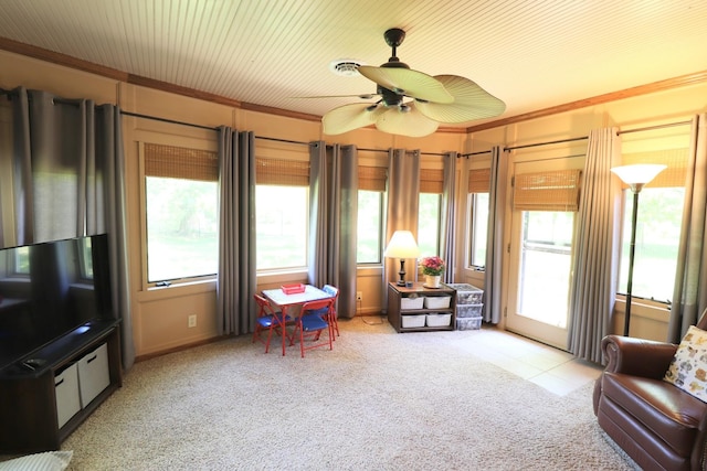 245 N Linn St, Princeton, IL 61356 - sitting room with plenty of natural light, crown molding, light carpet, and a ceiling fan
