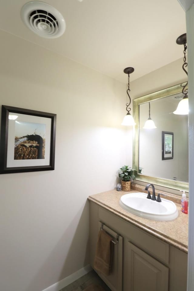 245 N Linn St, Princeton, IL 61356 - bathroom featuring vanity and baseboards