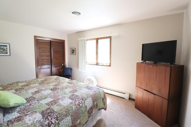245 N Linn St, Princeton, IL 61356 - bedroom with a baseboard heating unit, carpet flooring, and a closet