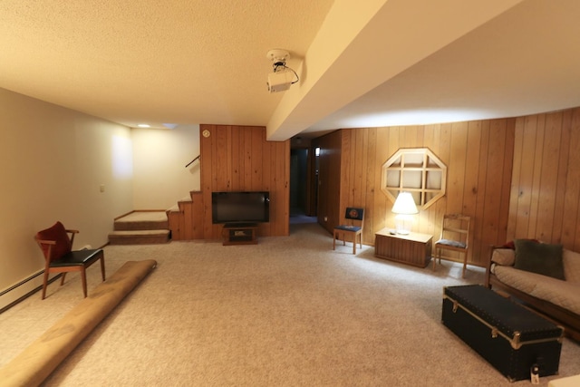 245 N Linn St, Princeton, IL 61356 - living area featuring carpet flooring, wood walls, a textured ceiling, and stairway