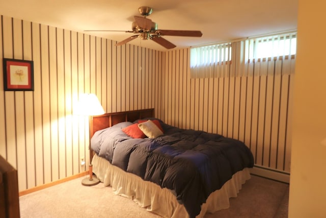 245 N Linn St, Princeton, IL 61356 - carpeted bedroom with a baseboard radiator and a ceiling fan