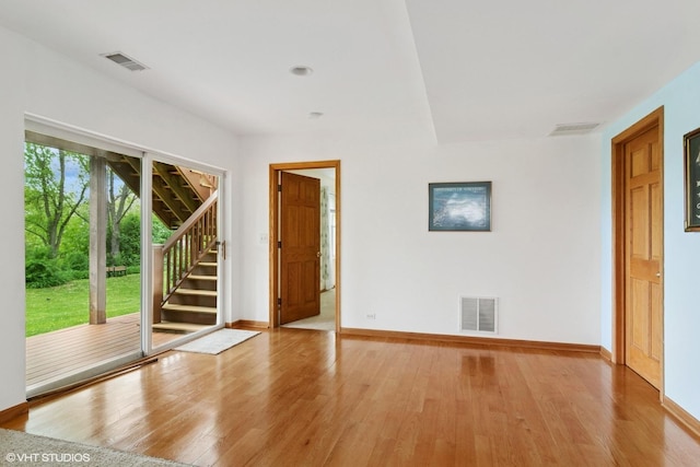 1048 N Palos Ave, Palatine, IL 60067 - unfurnished room with baseboards, stairway, and light wood finished floors