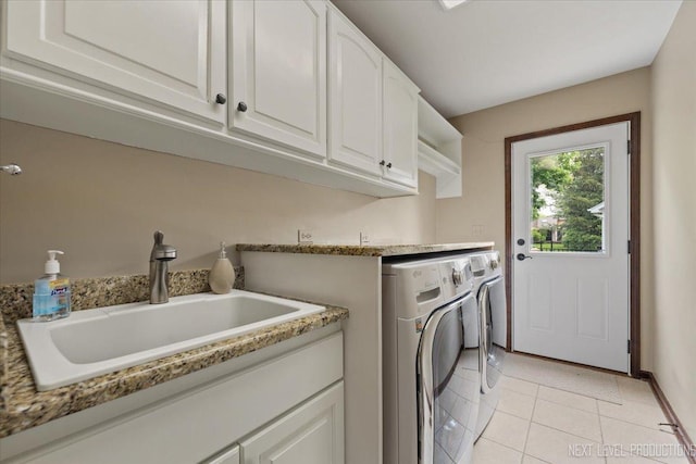 6446 Hanover Ct, Lisle, IL 60532 - laundry area with washer and dryer, cabinet space, light tile patterned floors, and baseboards