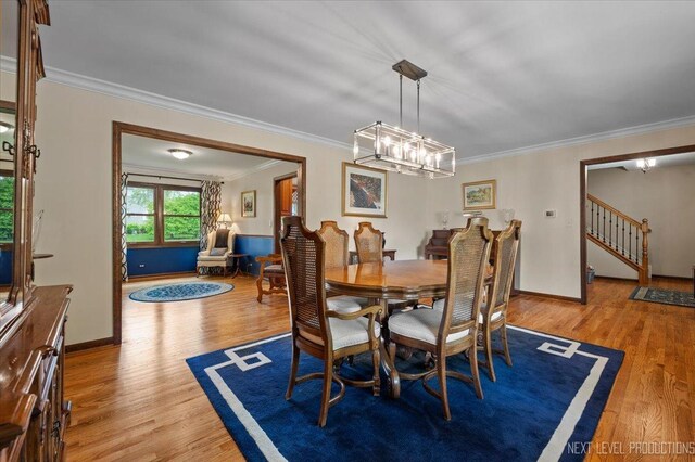 6446 Hanover Ct, Lisle, IL 60532 - dining area with crown molding, light wood-style flooring, stairs, baseboards, and a chandelier
