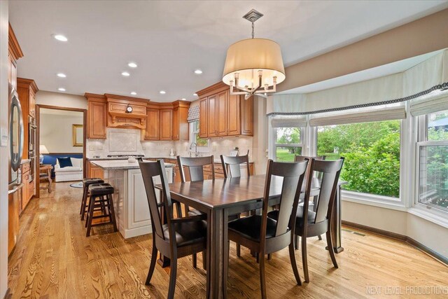6446 Hanover Ct, Lisle, IL 60532 - dining room featuring light wood-style flooring, a chandelier, recessed lighting, and baseboards