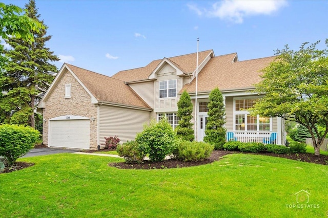 1748 Pinnacle Dr, Aurora, IL 60502 - view of front of house featuring a front lawn, a garage, driveway, covered porch, and a shingled roof