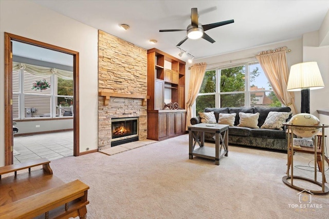 1748 Pinnacle Dr, Aurora, IL 60502 - carpeted living room with a ceiling fan and a fireplace