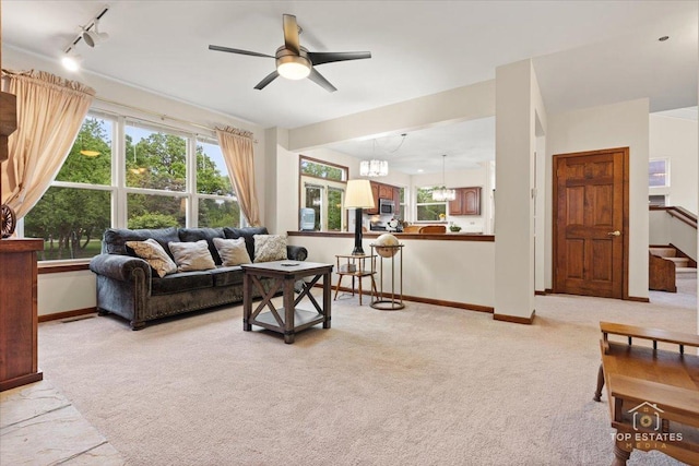 1748 Pinnacle Dr, Aurora, IL 60502 - living room featuring light carpet, ceiling fan, and rail lighting
