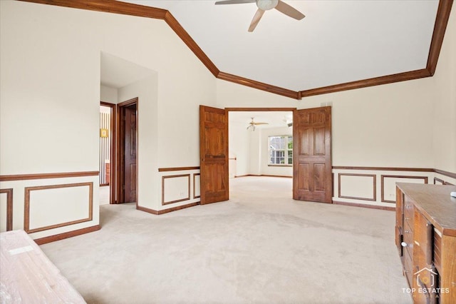 1748 Pinnacle Dr, Aurora, IL 60502 - unfurnished room with crown molding, a ceiling fan, vaulted ceiling, wainscoting, and light colored carpet