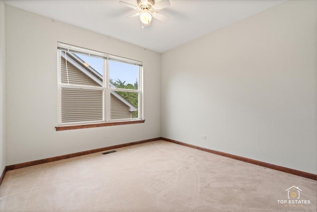 1748 Pinnacle Dr, Aurora, IL 60502 - empty room with ceiling fan, light colored carpet, and baseboards