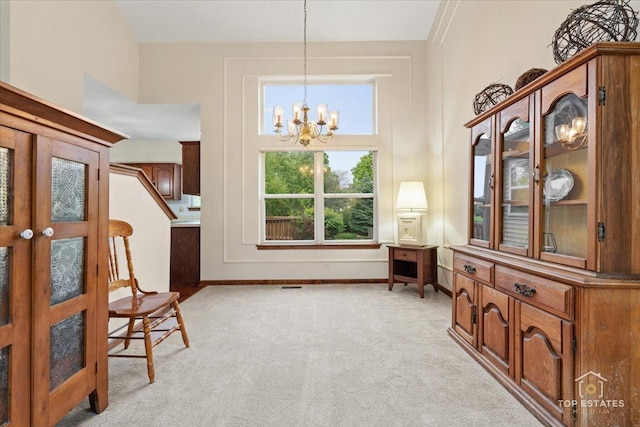 1748 Pinnacle Dr, Aurora, IL 60502 - sitting room with light colored carpet, a chandelier, and baseboards