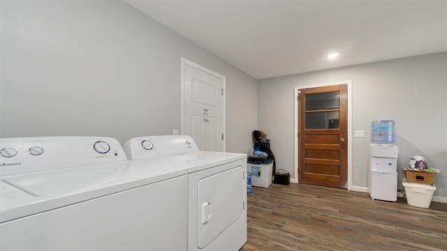 801 Adams St, Oregon, IL 61061 - washroom with separate washer and dryer, dark wood-type flooring, baseboards, and recessed lighting