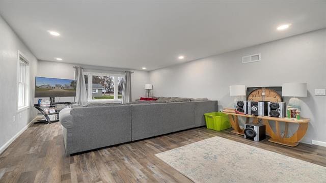801 Adams St, Oregon, IL 61061 - living room with healthy amount of natural light, wood finished floors, baseboards, and recessed lighting