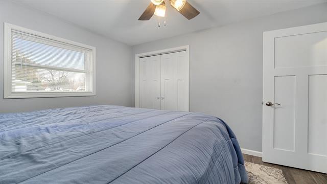 801 Adams St, Oregon, IL 61061 - bedroom featuring wood finished floors, ceiling fan, baseboards, and a closet
