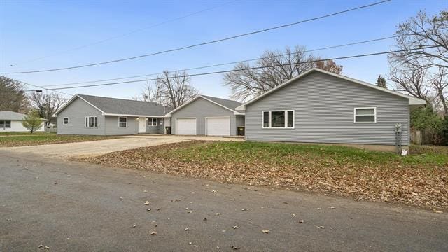 801 Adams St, Oregon, IL 61061 - single story home featuring concrete driveway and an attached garage