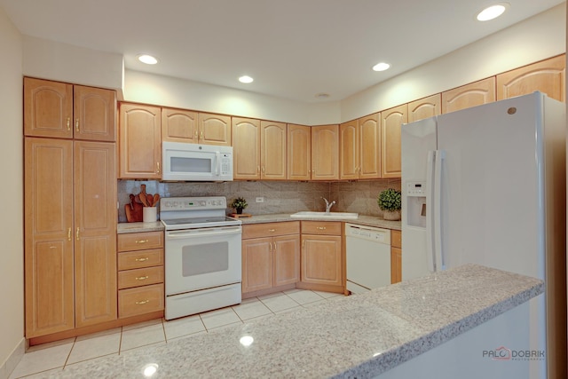 1088 Shermer Rd Unit 307, Northbrook, IL 60062 - kitchen with white appliances, light brown cabinetry, a sink, light tile patterned floors, and decorative backsplash