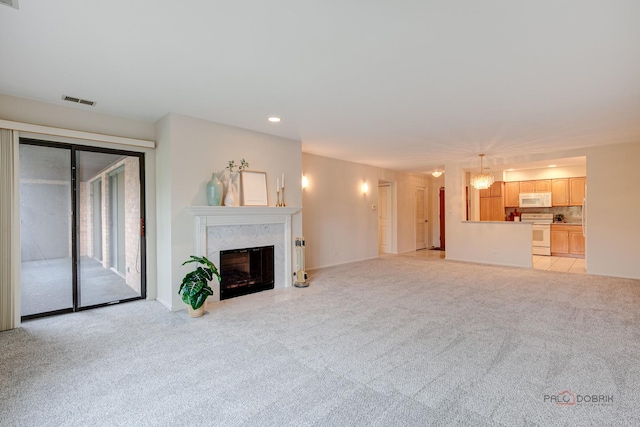 1088 Shermer Rd Unit 307, Northbrook, IL 60062 - unfurnished living room featuring light carpet, a premium fireplace, recessed lighting, and baseboards