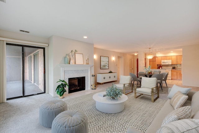 1088 Shermer Rd Unit 307, Northbrook, IL 60062 - living room featuring a fireplace, recessed lighting, light carpet, and baseboards