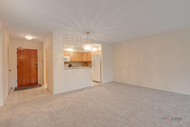 1088 Shermer Rd Unit 307, Northbrook, IL 60062 - unfurnished living room with light colored carpet, a chandelier, light tile patterned floors, and baseboards