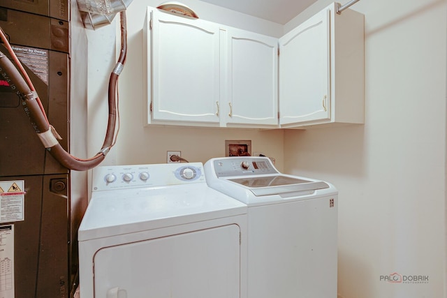 1088 Shermer Rd Unit 307, Northbrook, IL 60062 - washroom featuring separate washer and dryer and cabinet space