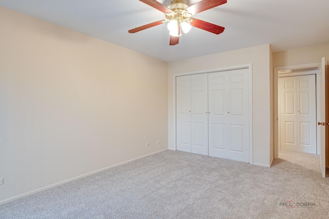 1088 Shermer Rd Unit 307, Northbrook, IL 60062 - unfurnished bedroom featuring carpet, a closet, baseboards, and ceiling fan