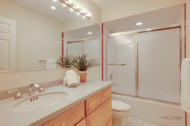 1088 Shermer Rd Unit 307, Northbrook, IL 60062 - bathroom featuring vanity, tile patterned floors, toilet, combined bath / shower with glass door, and recessed lighting